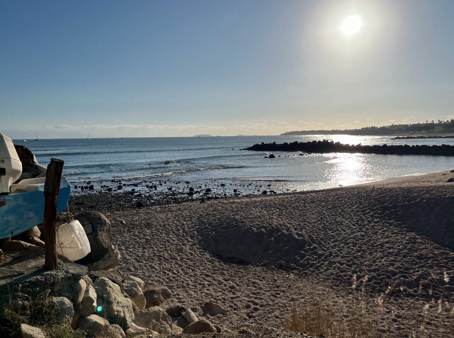 Sun-drenched Pacific horizon from the villa's private beach